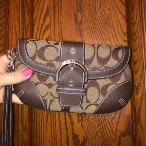 Coach clutch/wallet pockets inside